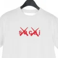 sacai x KAWS の Flock Print Tee が発売